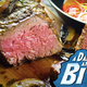 Close-up of juicy steak with Dark + Stormy Bite logo